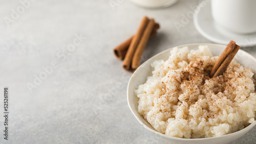  Scandinavian rice porridge in a bowl with cinnamon. Healthy breakfast. Copy space