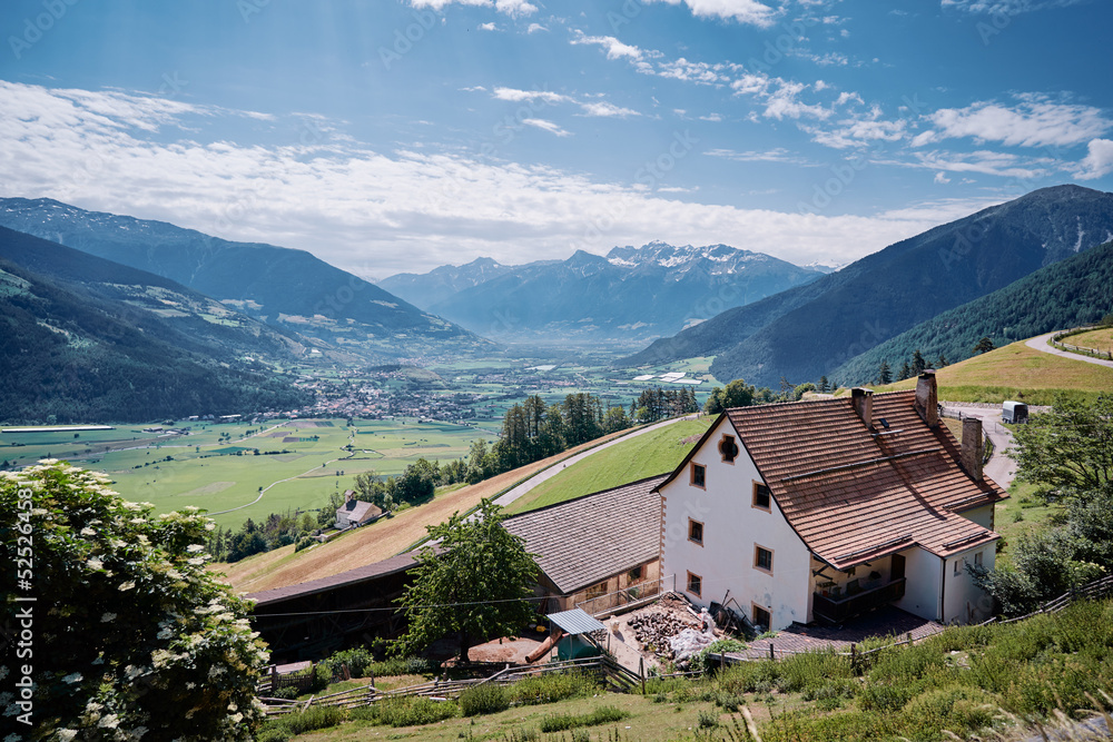 Alpine mountains landscape. Traditional farm house with wonderfull view.