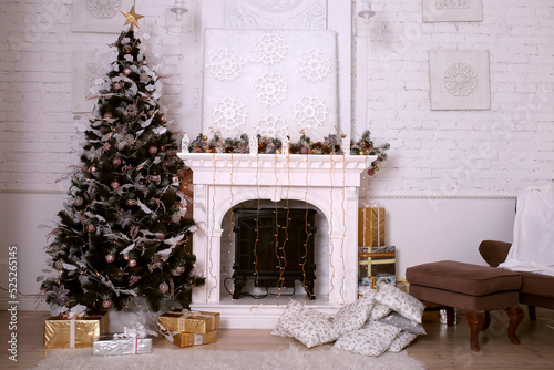 New Year's interior for a home or studio with a fireplace and a Christmas tree © Katsiaryna