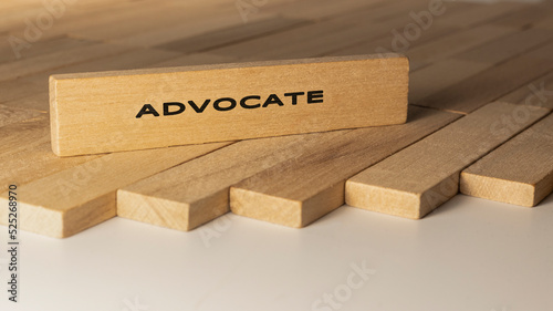 Advocate written on wooden surface. Concept created from wooden sticks