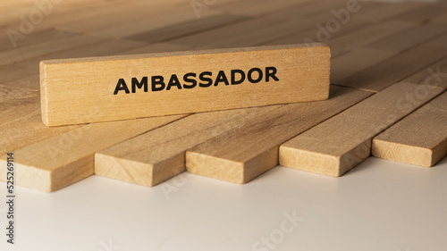 Ambassador written on wooden surface. Concept created from wooden sticks