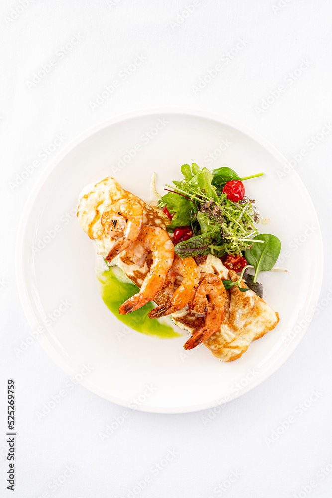 pancakes with shrimps and salad mix