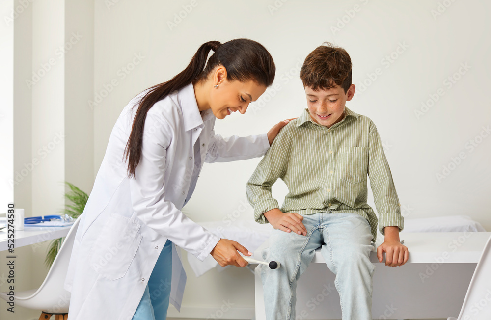 Happy, friendly doctor examining a child. Professional neurologist uses