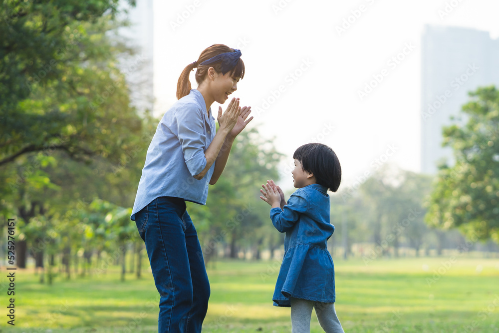 Daughter playing with mother in the garden. Daughter playing with mother in the garden.