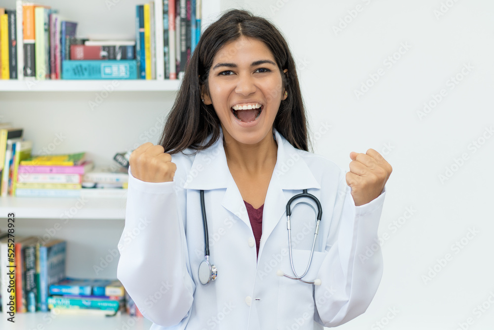 Motivated south american female doctor with stethoscope Motivated south american female doctor with stethoscope
