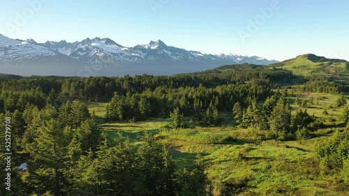 Aerial view Inspiring Hiking Camping Landscape. Spruce trees, snow-covered mountains. Vacation, Travel to Kenai Peninsula, Alaska, United States photo