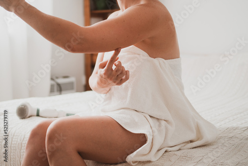 woman makes massage against cellulite and sagging skin on her hands.
