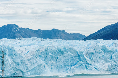 A giant chunk of ice breaking off the magnificent Perito Moreno Glacier in Patagonia, Argentina.