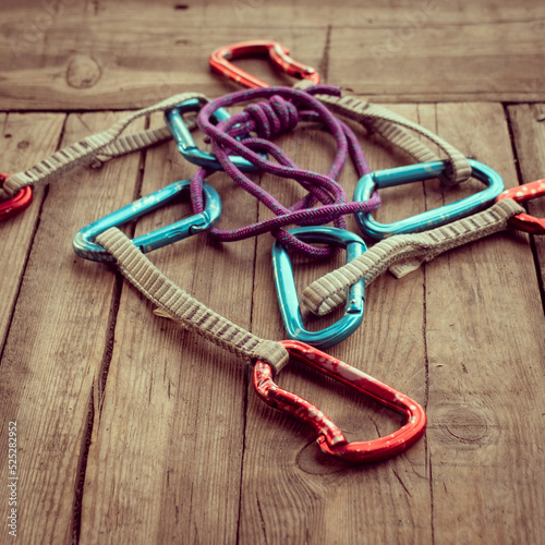 Climbing equipment on wooden background