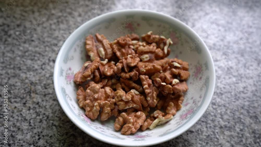 Peeled Walnuts In A Ceramic Bowl. - closeup Peeled Walnuts In A Ceramic Bowl. - closeup