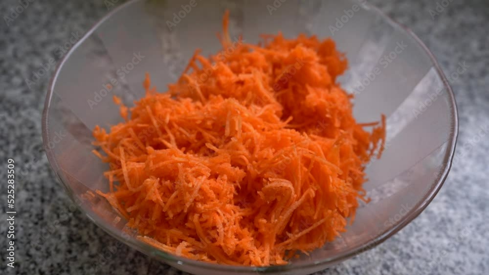 Bowl Of Grated Carrots, Ingredient For Carrot Cake. - close up