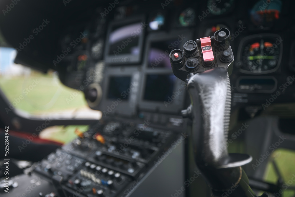 Close-up of helicopter flight control inside cockpit.. Close-up of helicopter flight control inside cockpit..