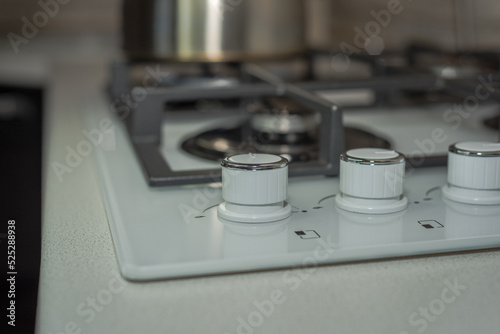 The gas supply handle of the kitchen stove.