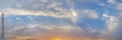 Colorful bright panorama sunset sky with clouds