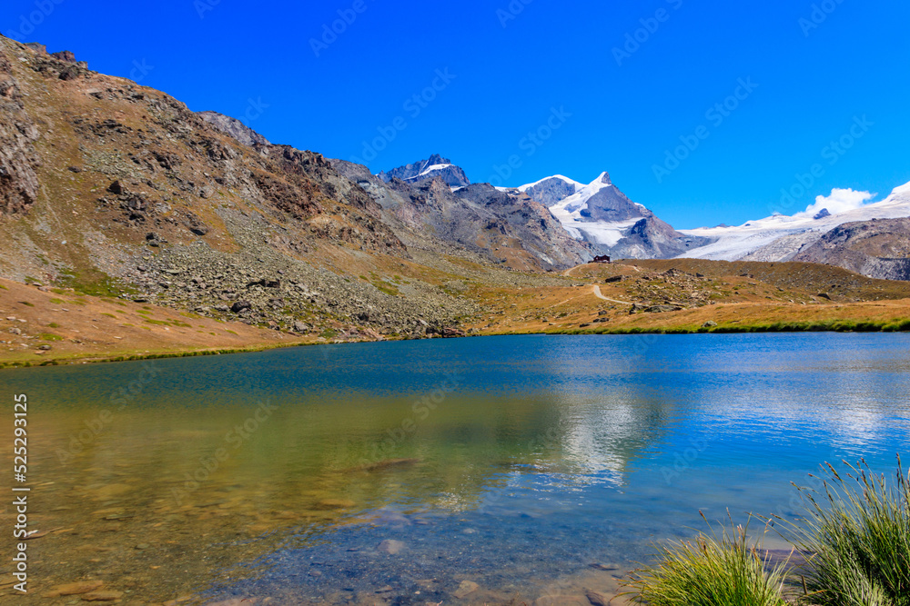 View of Stelli Lake (Stellisee) and Swiss Alps at summer in Zermatt, Switzerland View of Stelli Lake (Stellisee) and Swiss Alps at summer in Zermatt, Switzerland