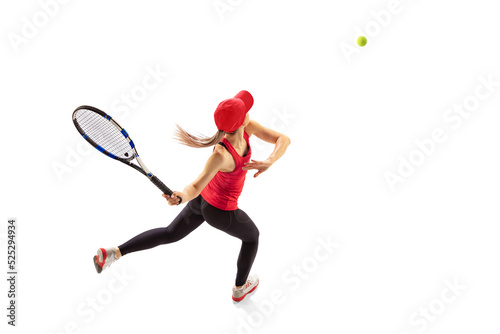 Training of female tennis player practicing power serving isolated on white background. Healthy lifestyle, fitness, sport, achievements concept. © master1305