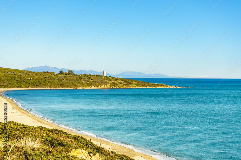 Coast with sandy beach and lighthouse, Spain. Coast with sandy beach and lighthouse, Spain.
