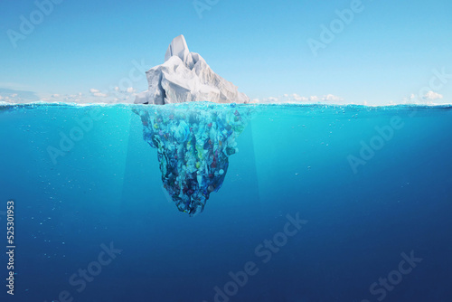 Creative iceberg floating in the ocean with garbage plastic bottles underwater. Global warming and pollution, a concept. Pollution of water and oceans