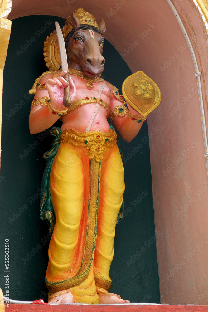 Statue of God Hayagriva on the wall of a Hindu temple in India. Avatar of Vishnu with the head
