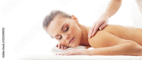 Young  beautiful and healthy woman in spa salon. Traditional massage therapy and skin care treatments.