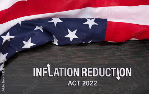 Fotobehang Inflation reduction act of 2022 concept with United States flag on top