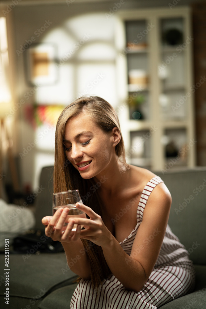 Girl holding a glass of water. Smiling girl drinking water.. Girl holding a glass of water. Smiling girl drinking water..