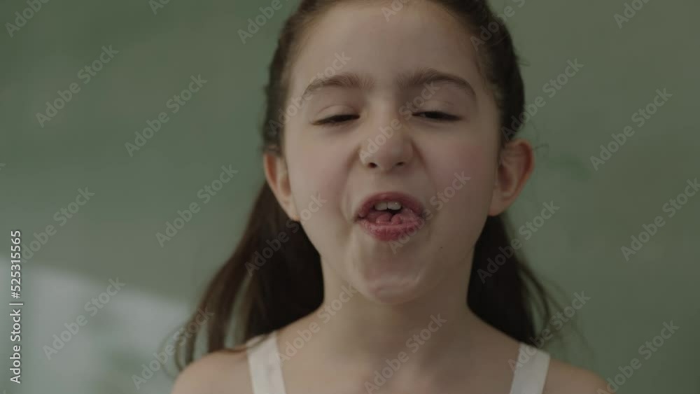 A girl's mouth is a trait inherited from her parents, with her