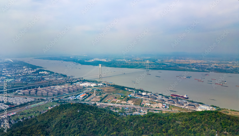 Obraz premium Aerial photography of Nanjing Fourth Bridge and busy transport ships in the Yangtze River in Nanjing City, Jiangsu Province, China in the smog