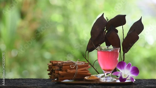 Sappan or caesalpinia sappan and water extract on nature background.