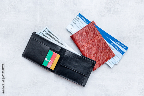 Wallet with money cash and travel tickets in passport