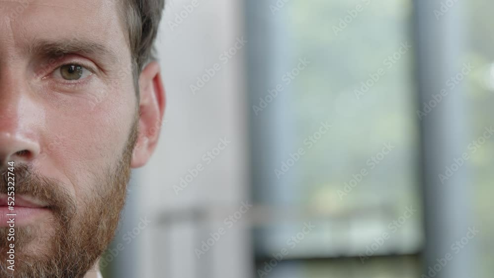 Male half face part front view close up serious man bearded adult 40s millennial looking at camera opening eye blink problem with eyesight vision laser correction operation healthcare ophthalmology