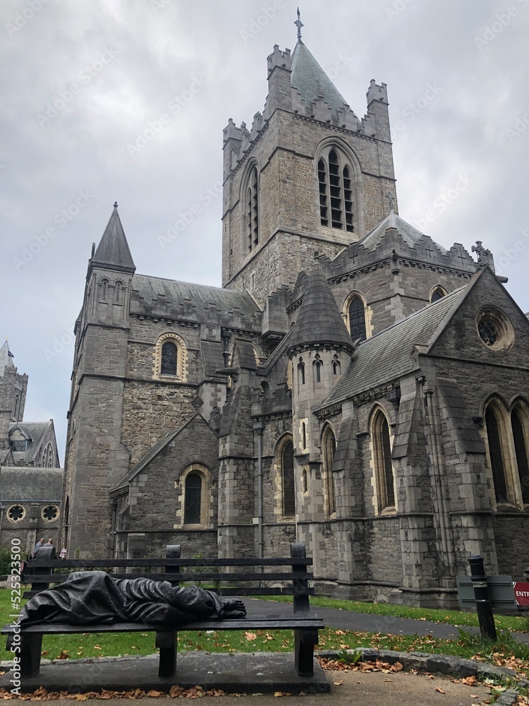 Christ Church Cathedral with a monument Homeless Jesus at the heart of Dublin, Ireland. Main Irish tourist attractions and best Ireland sightseeings. Medieval Irish architecture, old Irish cathedrals