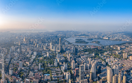 Aerial photography of Xuanwu Lake Scenic Spot and Greenland Zifeng Building in the distance, Nanjing City, Jiangsu Province, China