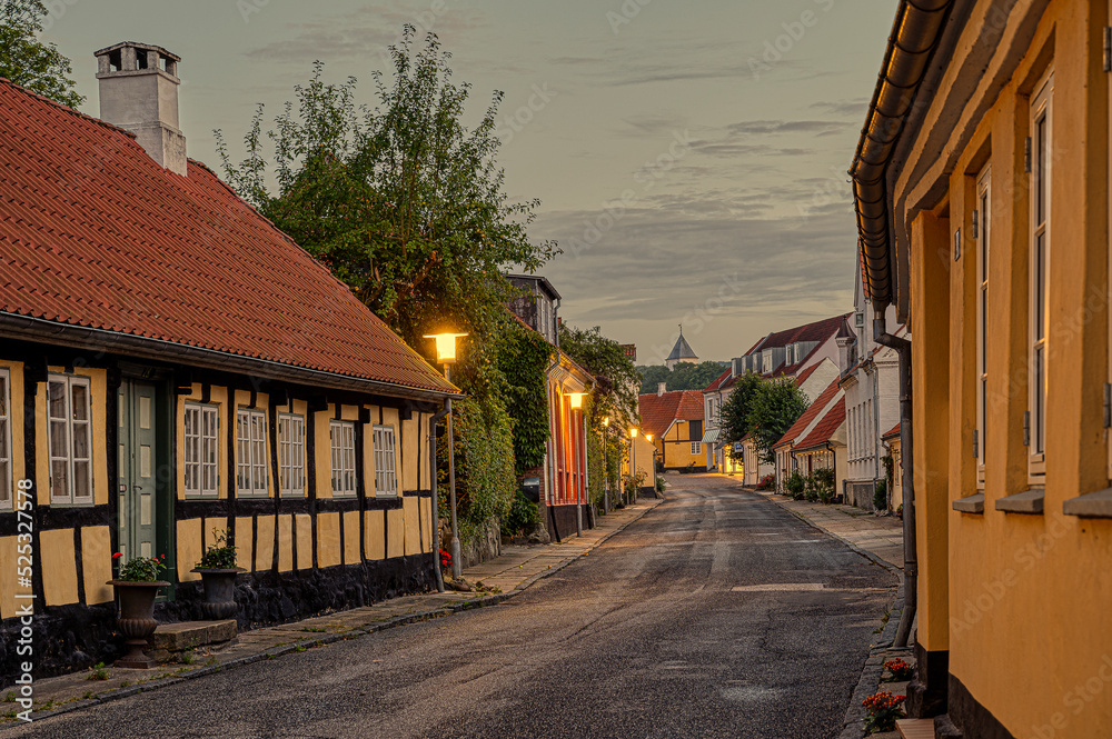 Picturesque road in the evening ligt to the church in Mariager Picturesque road in the evening ligt to the church in Mariager