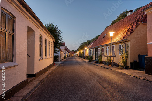 paved street with a timber framed house just after sunset in the idyllic town Mariager © Stig Alenas