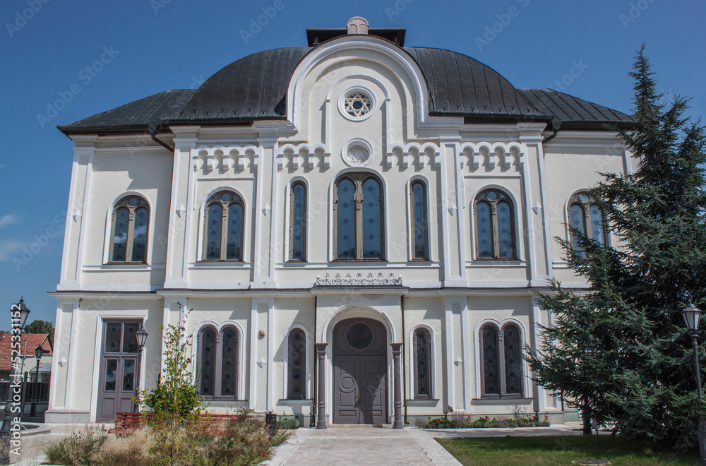 Exterior view of the Great Synagogue in the downtown of the famous and historical Tokaj wine region located in northeastern Hungary, Europe. Windows and walls with traditional ornaments.