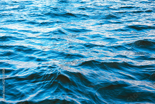 Wavy surface of water in a reservoir as an abstract background.