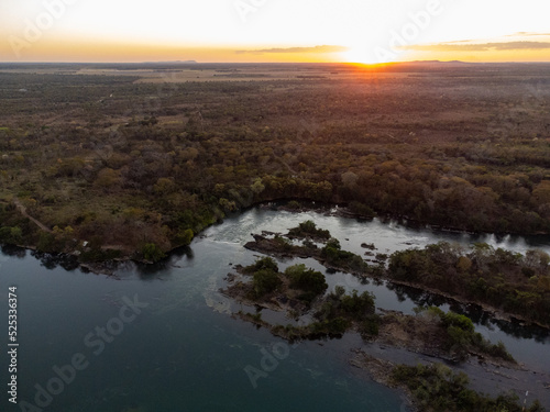 amazing red sunset under tocantins river in brazilian forest nature