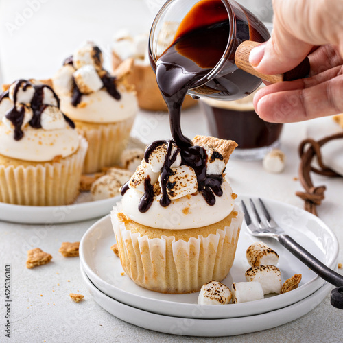 Smores cupcakes with graham crackers, toasted marshmallows and chocolate photo