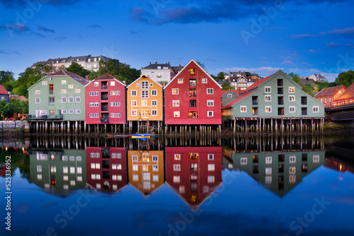 Colorful houses over Nidelva river in Trondheim city, Norway photo