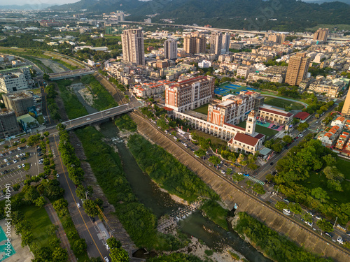 Taichung City, Taiwan - Aug 23, 2022 : Aerial view of Han River, Taichung city Beitun District buildings in sunset time. photo