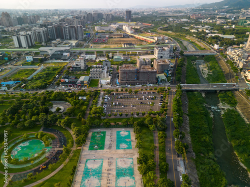 Taichung City, Taiwan - Aug 23, 2022 : Aerial view of Han River, Taichung city Beitun District buildings in sunset time. photo