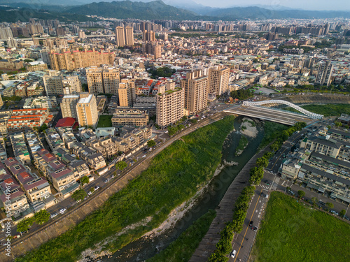 Taichung City, Taiwan - Aug 23, 2022 : Aerial view of Han River, Taichung city Beitun District buildings in sunset time. photo