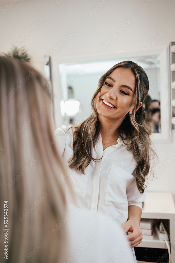 Makeup process. Professional artist applying make up on model face. Close up portrait of beautiful blonde woman in beauty saloon. Makeup process. Professional artist applying make up on model face. Close up portrait of beautiful blonde woman in beauty saloon.