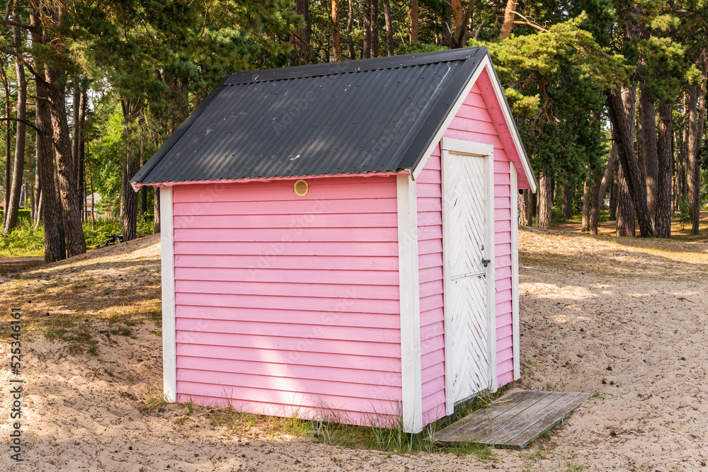 Little cozy pink wooden house on a beach Little cozy pink wooden house on a beach