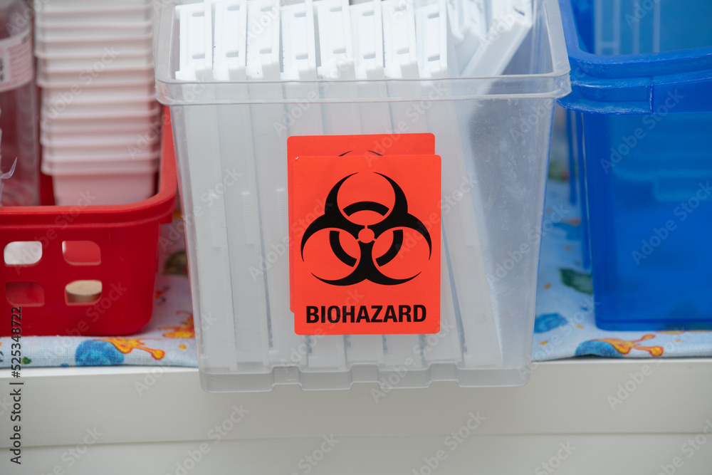 Medical waste bin with biohazard sign in hospital. Biohazardous