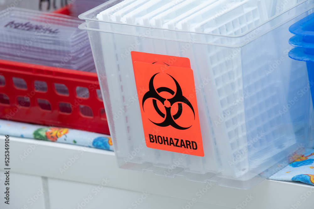 Medical waste bin with biohazard sign in hospital. Biohazardous