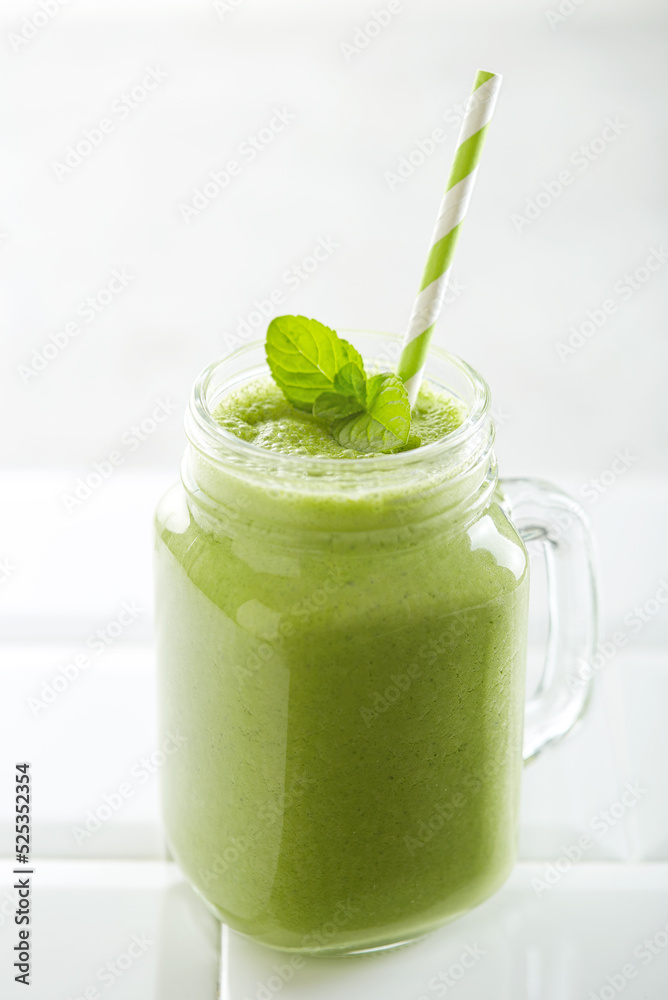 Spinach smoothie on a white background Spinach smoothie on a white background