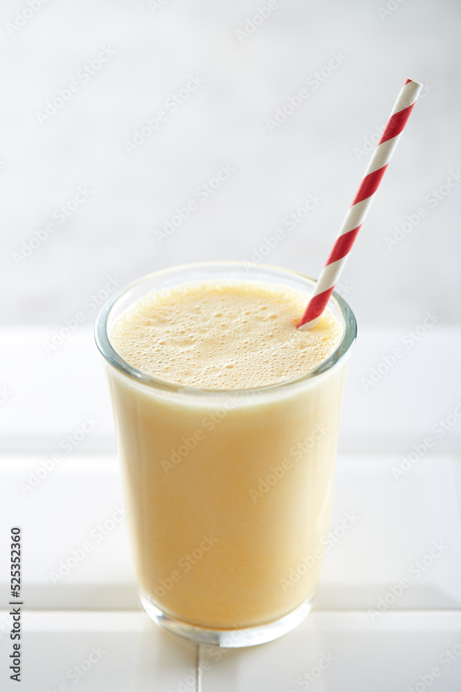 Banana smoothie on a white background Banana smoothie on a white background