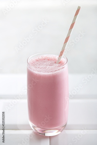Red fruit smoothie on a white background